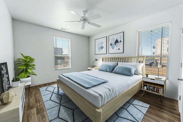 Cozy bedroom with modern decor at FLATZ 432 Apartments