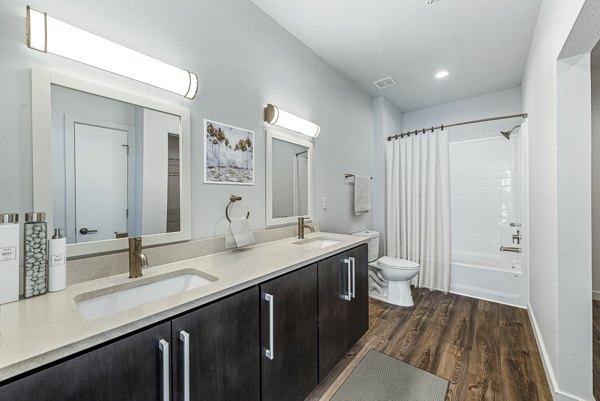 Modern bathroom featuring sleek fixtures and spacious design at FLATZ 432 Apartments