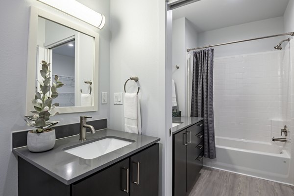 Modern bathroom with sleek finishes at FLATZ 432 Apartments, featuring contemporary design elements and luxurious fixtures