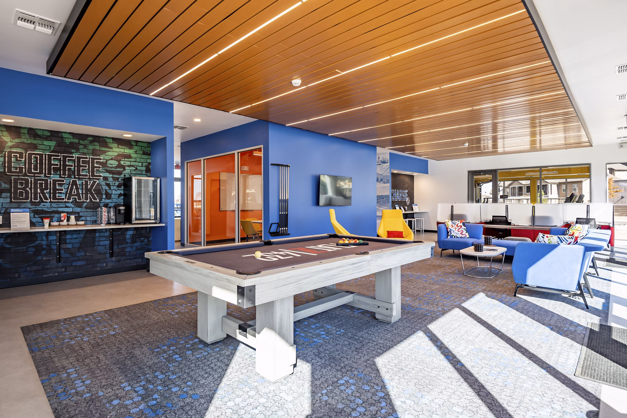 Clubhouse featuring modern decor and communal seating at FLATZ 432 Apartments