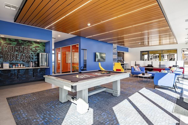Clubhouse featuring modern decor and communal seating at FLATZ 432 Apartments