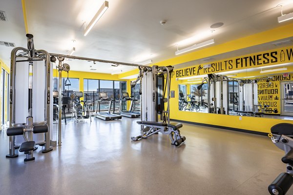 State-of-the-art fitness center with modern equipment at FLATZ 432 Apartments, offering luxury living and wellness facilities