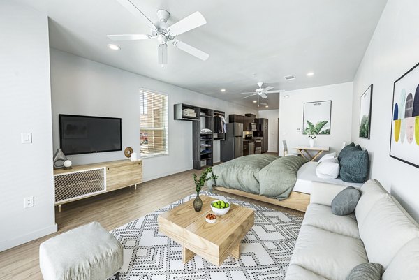 Spacious living room with modern decor in FLATZ 432 Apartments
