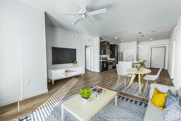 Spacious living room with modern decor in FLATZ 432 Apartments