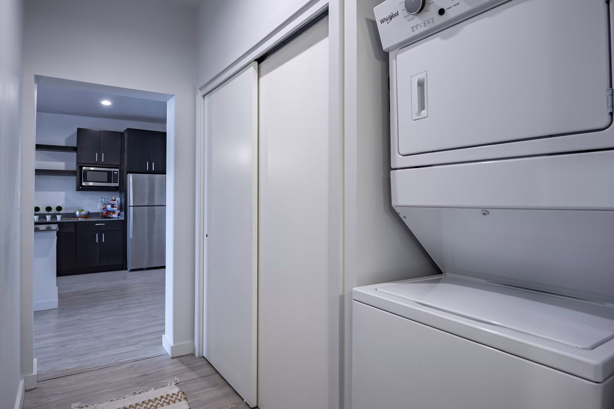 Laundry room with modern appliances at FLATZ 432 Apartments, convenient and efficient for urban living
