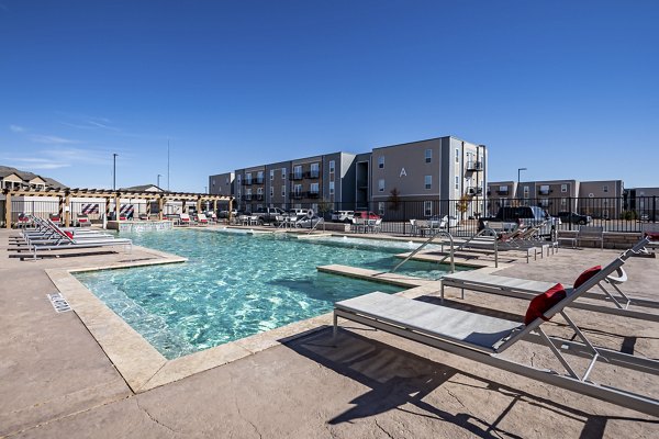 Modern pool area with lounge chairs at FLATZ 432 Apartments offering luxury living in an urban setting
