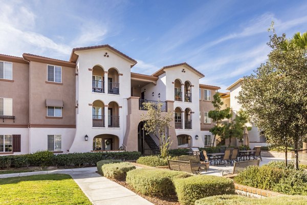 Courtyard featuring lush gardens and seating areas at Viano at Riverwalk luxury apartments