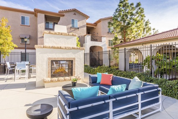Cozy outdoor fire pit area at Viano at Riverwalk Apartments, perfect for gatherings and relaxation