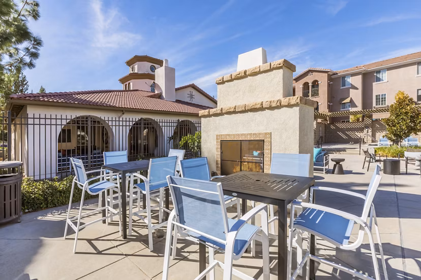 Cozy fire pit area at Viano at Riverwalk Apartments with comfortable seating for outdoor gatherings