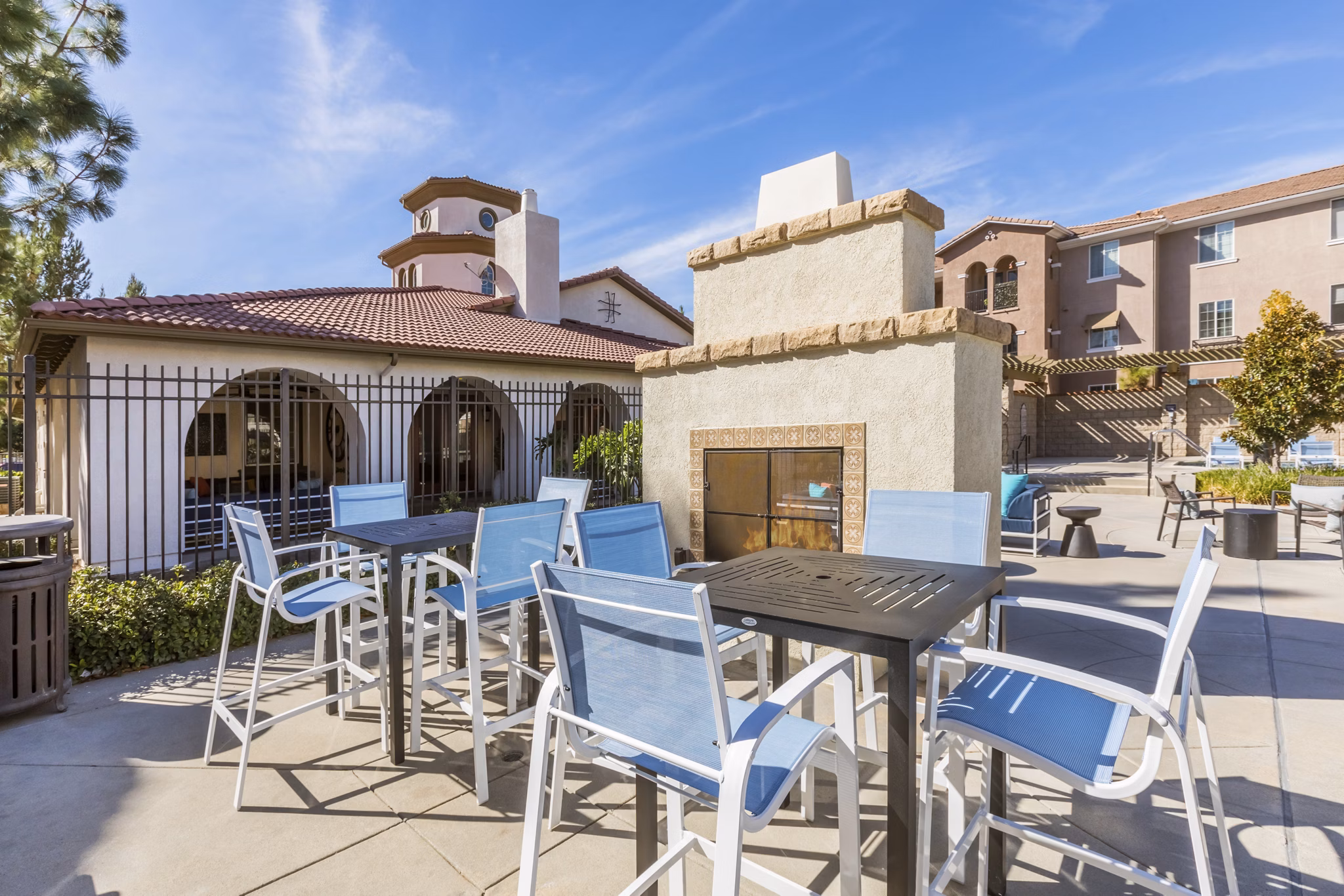 Cozy fire pit area at Viano at Riverwalk Apartments with comfortable seating for outdoor gatherings