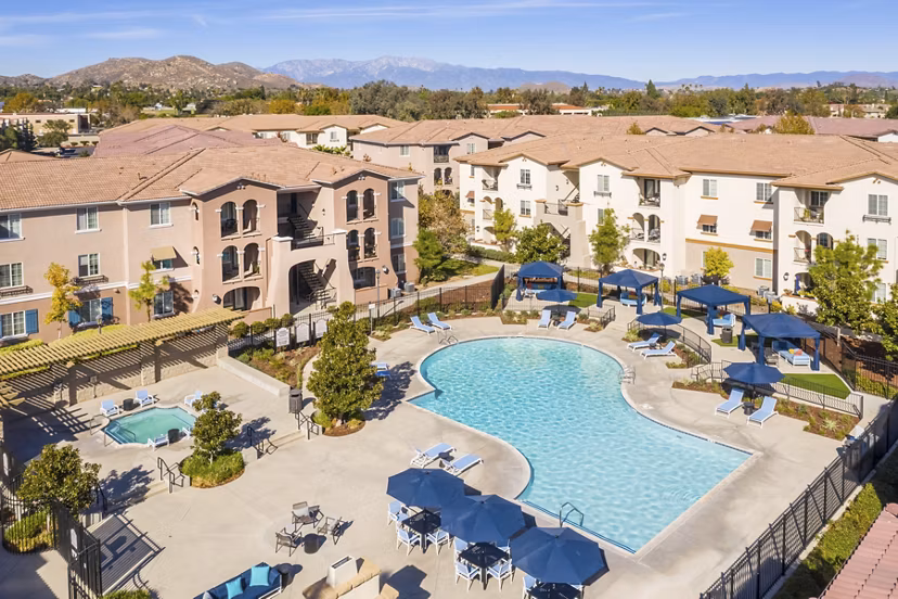 Scenic view at Viano at Riverwalk Apartments with lush greenery and modern architecture