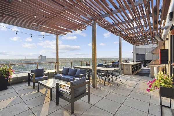 Scenic balcony with modern seating at Vela on The Park Apartments offering luxury living