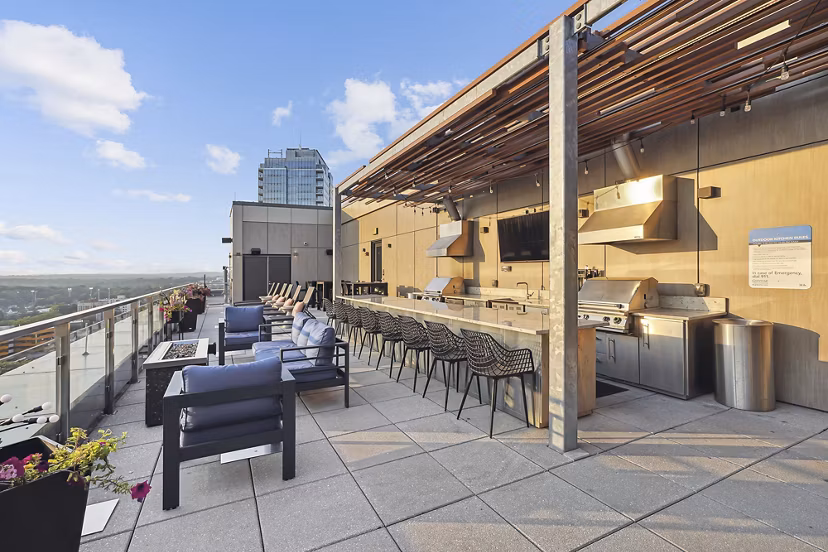 Vela on The Park: Outdoor grill area on a spacious patio at luxury apartments in Stamford Ideal for social gatherings and relaxation