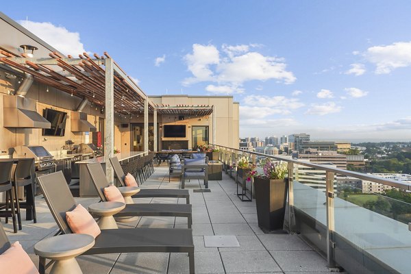 Spacious balcony with modern outdoor seating at Vela on The Park Apartments