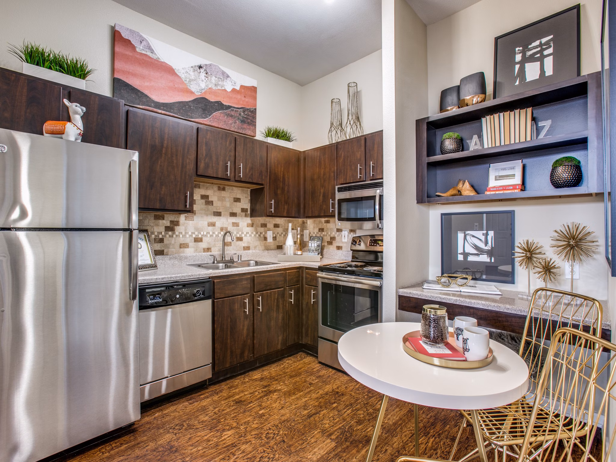 Modern kitchen with stainless steel appliances at Westmount at Mason Creek Apartments
