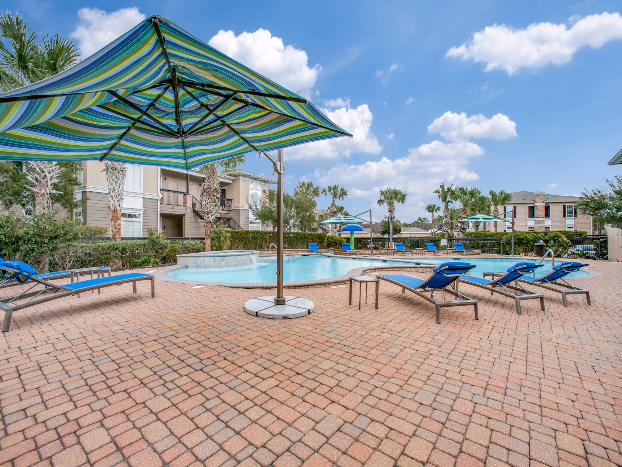 Resort-style pool with sundeck at Westmount at Mason Creek Apartments