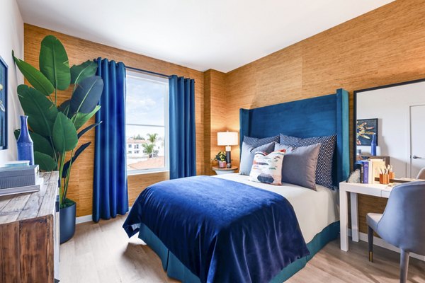 Spacious bedroom with modern decor at Cora Apartments, luxury living offered by Greystar