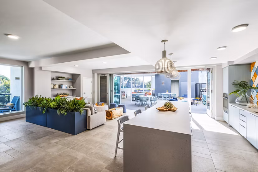 Cora Apartments: Stylish clubhouse featuring modern seating and lighting options in luxury community
