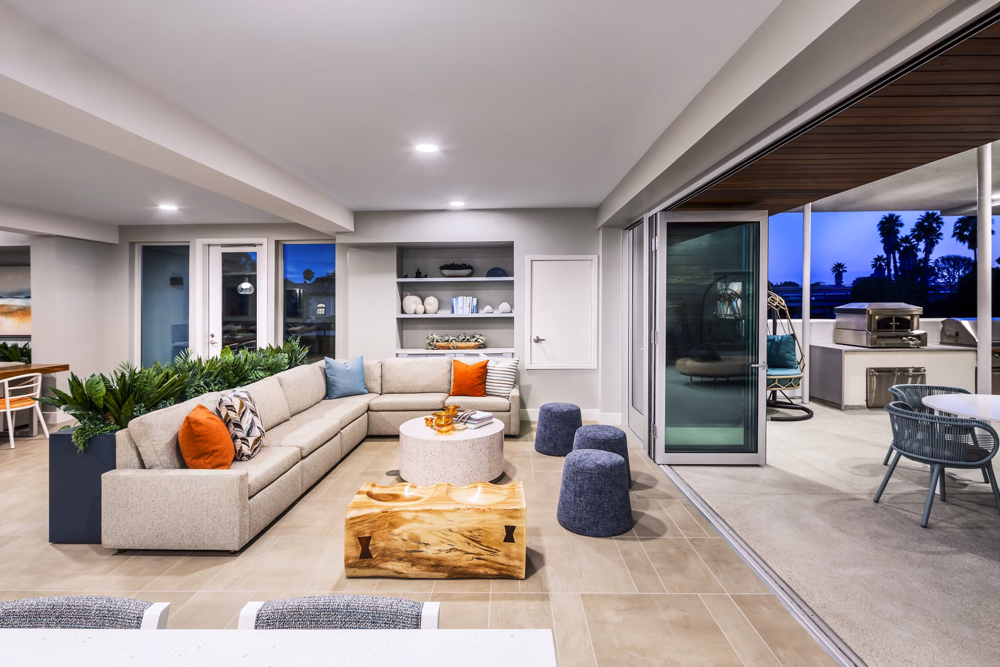 Cora Apartments: Modern clubhouse with cozy seating areas and bright decor in a vibrant community