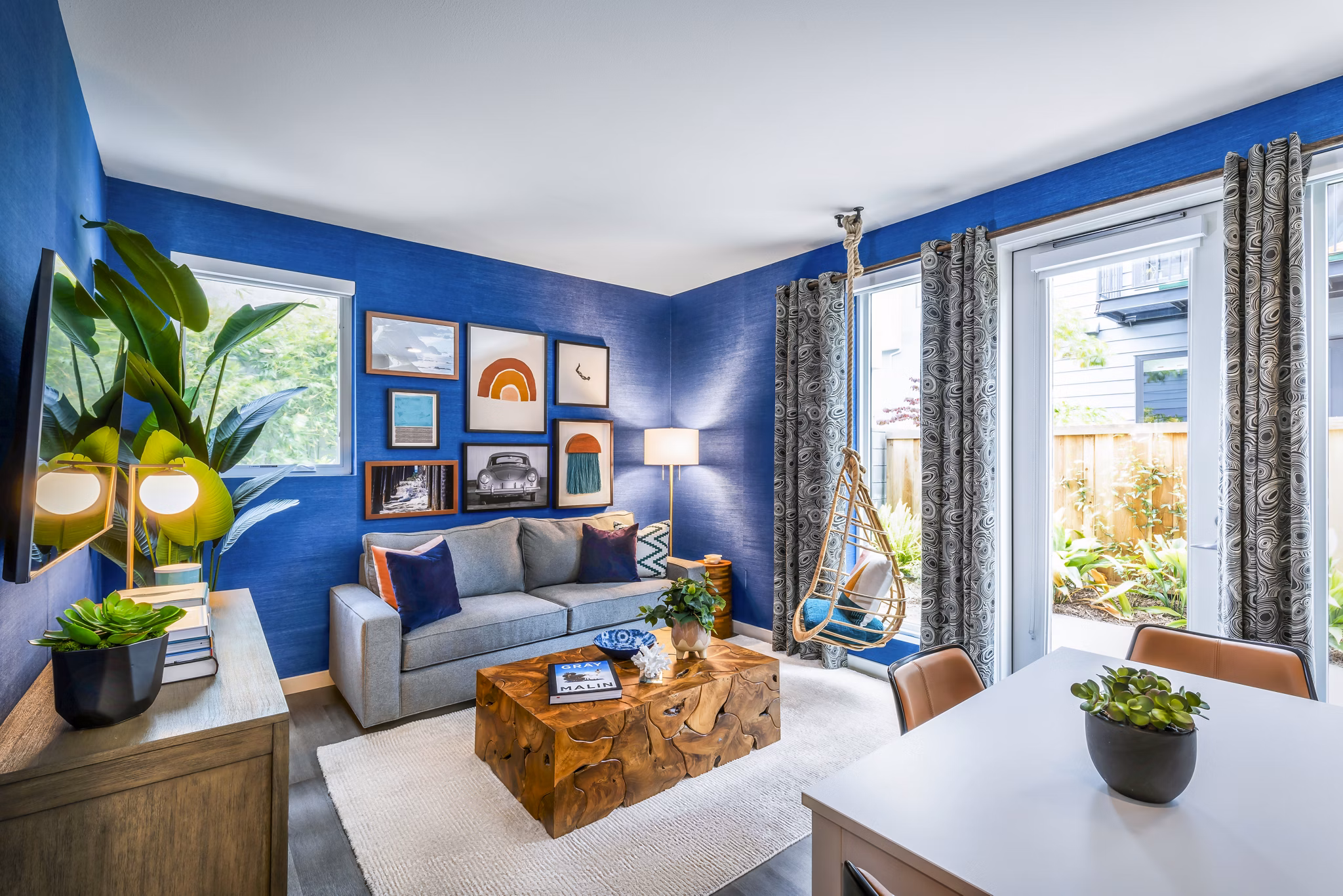 Modern living room with stylish furnishings at Cora Apartments, a luxury property in Greystar's upscale community portfolio
