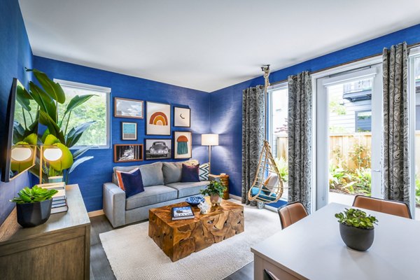 Modern living room with stylish furnishings at Cora Apartments, a luxury property in Greystar's upscale community portfolio