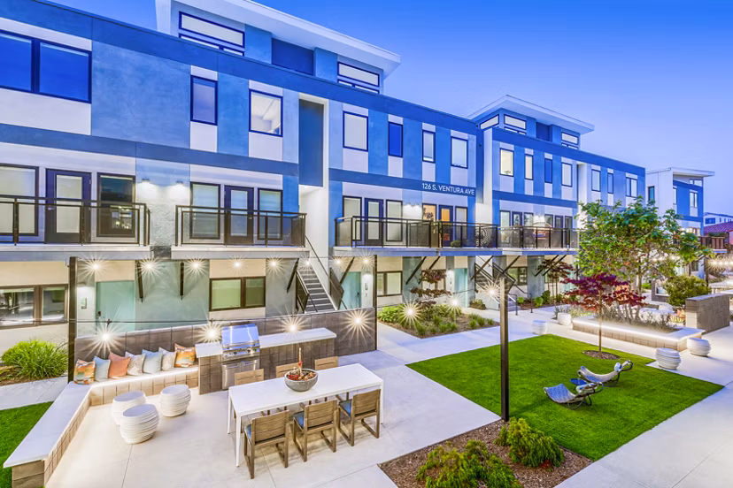Spacious patio with grill area at Cora Apartments, ideal for outdoor gatherings