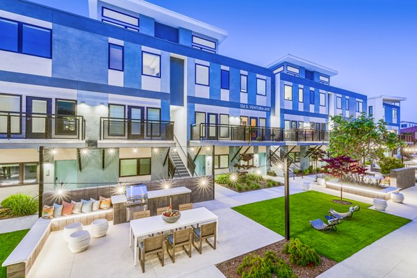 Spacious patio with grill area at Cora Apartments, ideal for outdoor gatherings