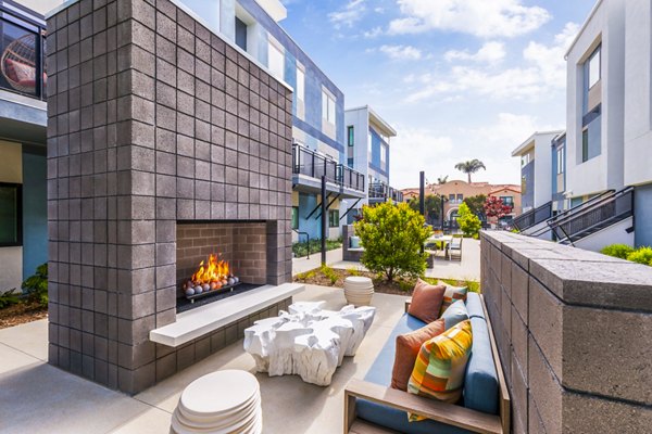 Fire pit on communal patio at Cora Apartments, a Greystar luxury apartment community
