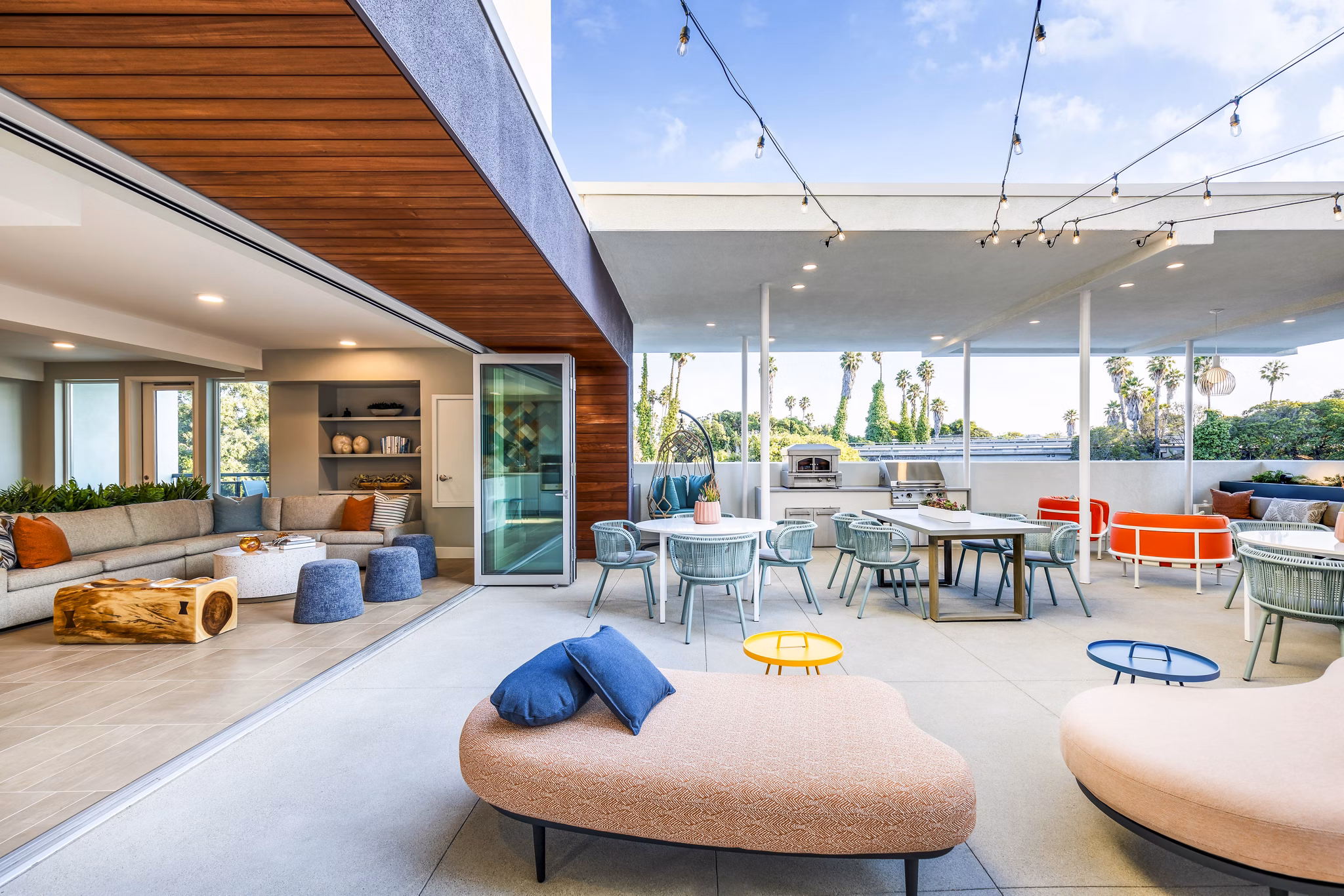 Outdoor grill area and patio at Cora Apartments offering stylish relaxation and dining space