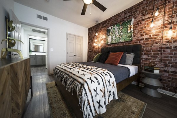 Bedroom featuring cozy furnishings and stylish decor at Muse at SoCo Apartments, Greystar luxury apartments