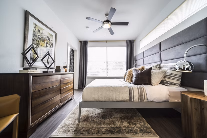 Modern bedroom with elegant decor at Muse at SoCo Apartments