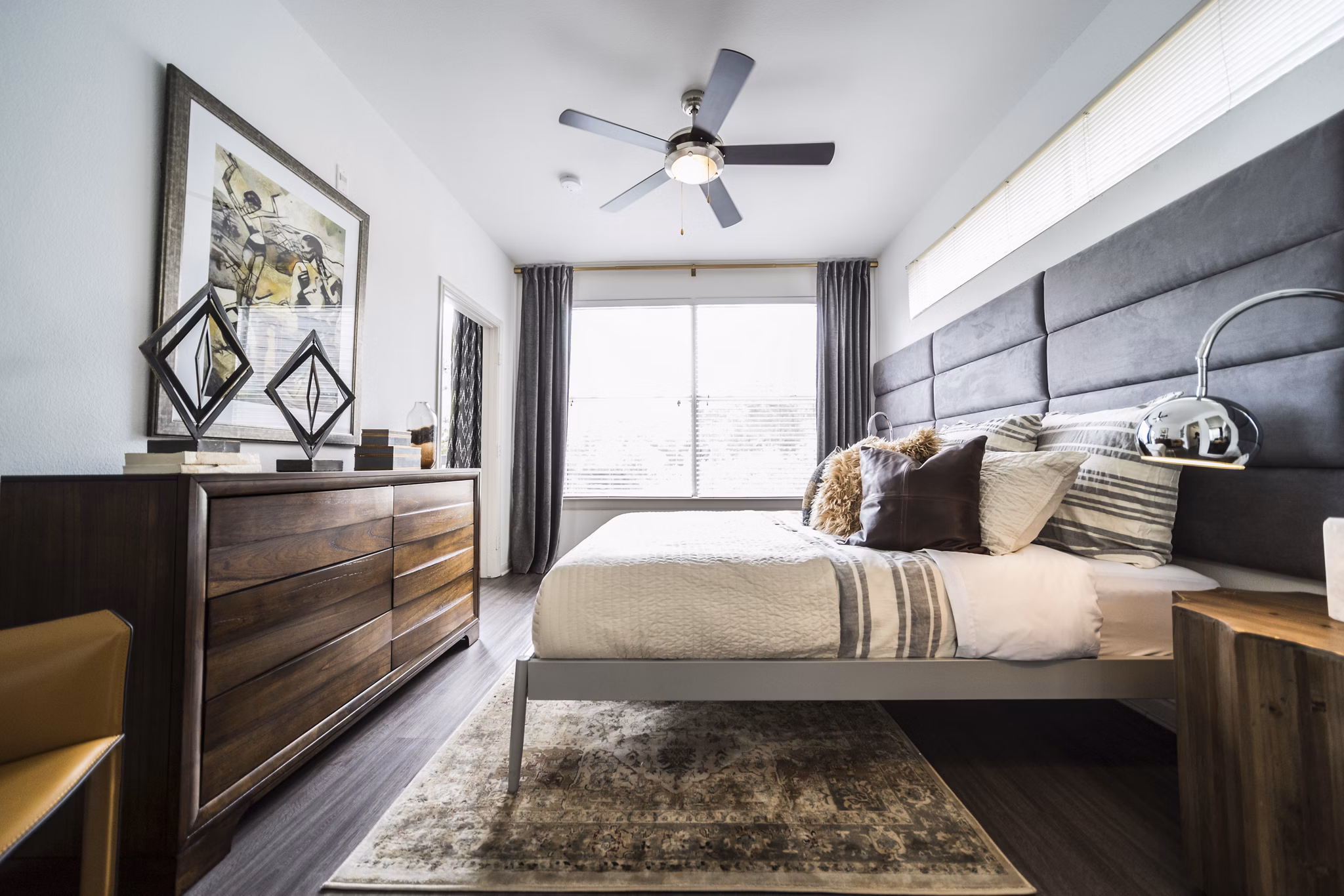 Modern bedroom with elegant decor at Muse at SoCo Apartments