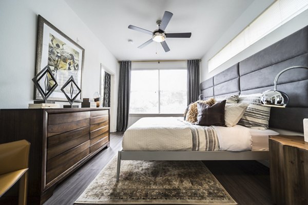 Modern bedroom with elegant decor at Muse at SoCo Apartments