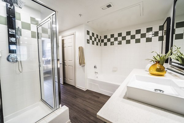 Modern bathroom with sleek fixtures at Muse at SoCo Apartments, offering luxury living in the heart of the community