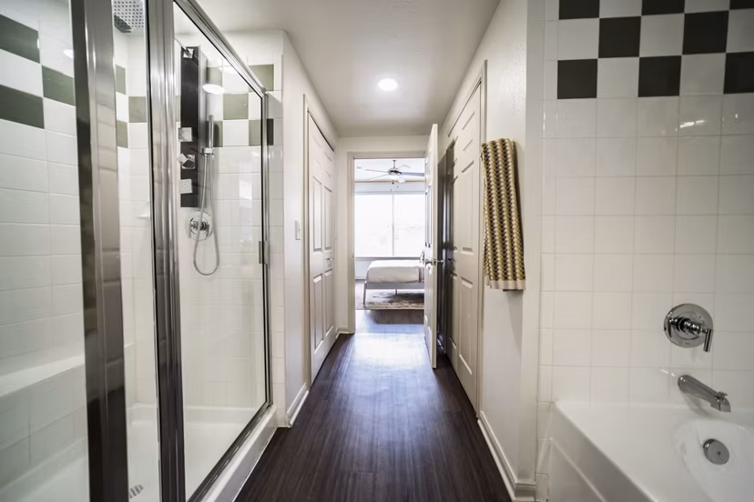 Bathroom featuring sleek fixtures and modern design at Muse at SoCo Apartments, a luxury community by Greystar