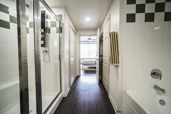 Bathroom featuring sleek fixtures and modern design at Muse at SoCo Apartments, a luxury community by Greystar