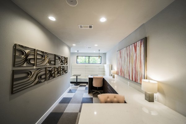 Clubhouse featuring modern design and cozy seating at Muse at SoCo Apartments in Austin Ideal for meetings and social gatherings