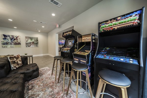 Muse at SoCo Apartments: Modern clubhouse with stylish seating areas and entertainment options in vibrant Austin community