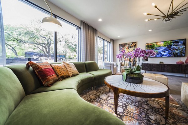 Clubhouse featuring modern design and social lounge in Muse at SoCo Apartments
