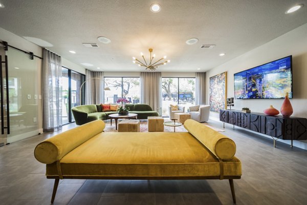Clubhouse featuring modern design and cozy seating at Muse at SoCo Apartments