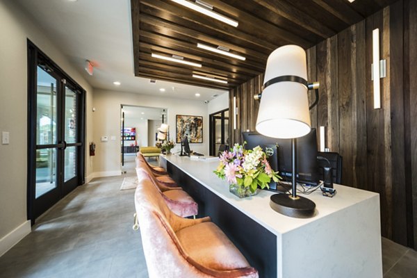Modern clubhouse with stylish seating and decor at Muse at SoCo luxury apartments in Austin