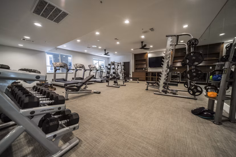 State-of-the-art fitness center featuring modern equipment at Muse at SoCo Apartments in Austin