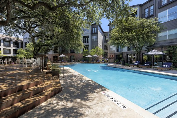 Rooftop pool with lounge chairs at Muse at SoCo Apartments offering luxury living in the vibrant South Congress neighborhood