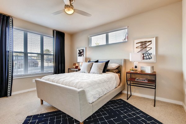 Cozy bedroom with modern furnishings in Hays Park Apartments, luxury living space