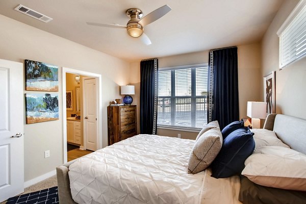 Bedroom featuring modern design and soft lighting in Hays Park Apartments