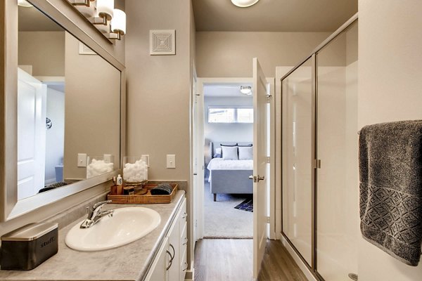 Modern bathroom with dual sinks and elegant fixtures at Hays Park Apartments