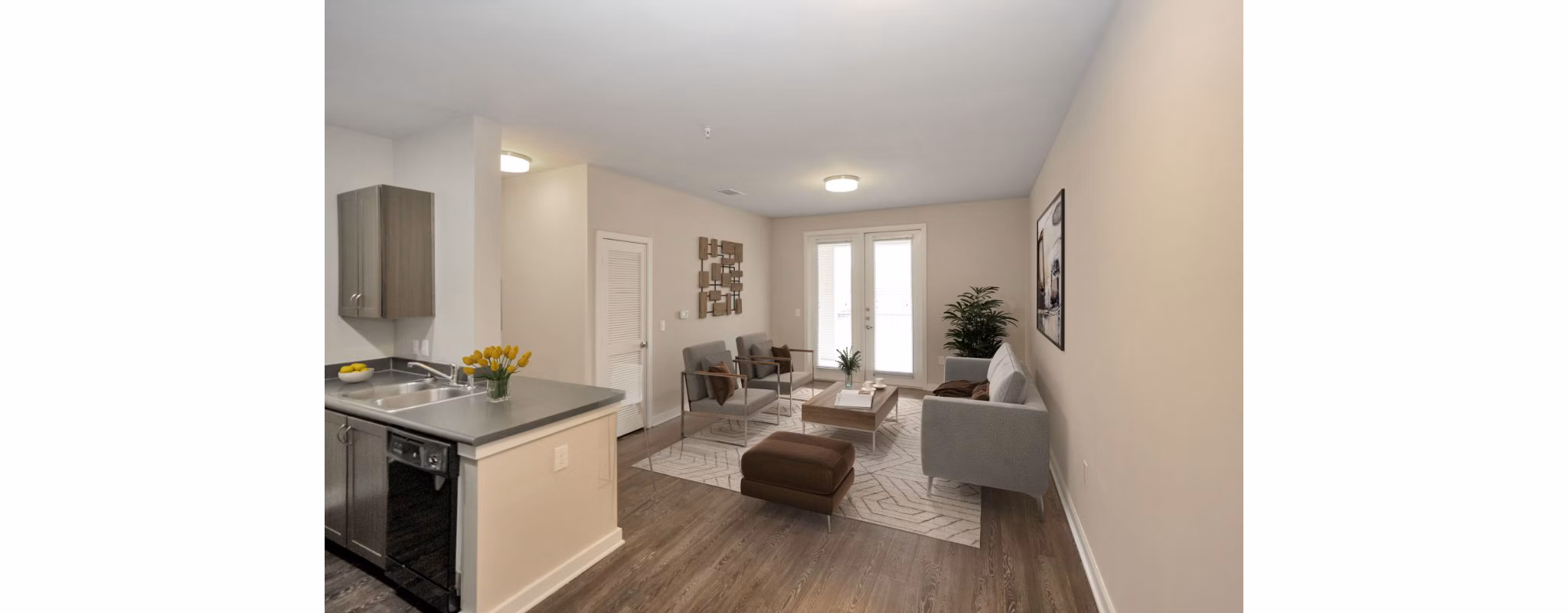 Elegant living room featuring modern decor and hardwood floors in Hays Park Apartments
