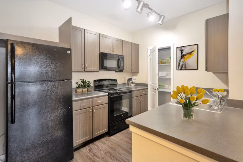 Modern kitchen featuring stainless steel appliances at Hays Park Apartments