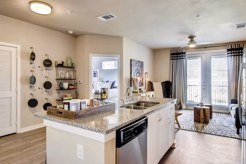 Modern kitchen with stainless steel appliances in Hays Park Apartments, luxury living by Greystar
