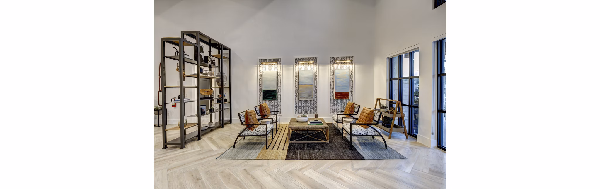 Clubhouse at Leander Park Apartments featuring modern design and ample seating areas in a luxury community setting